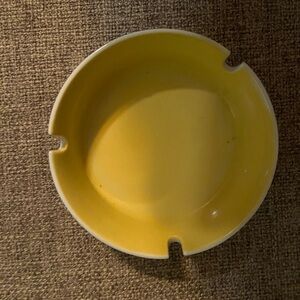 Yellow ashtray.